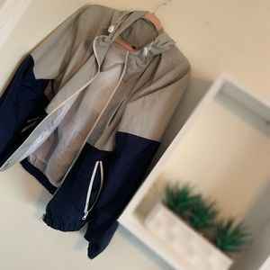 Grey and Navy thin rain coat, shell jacket.